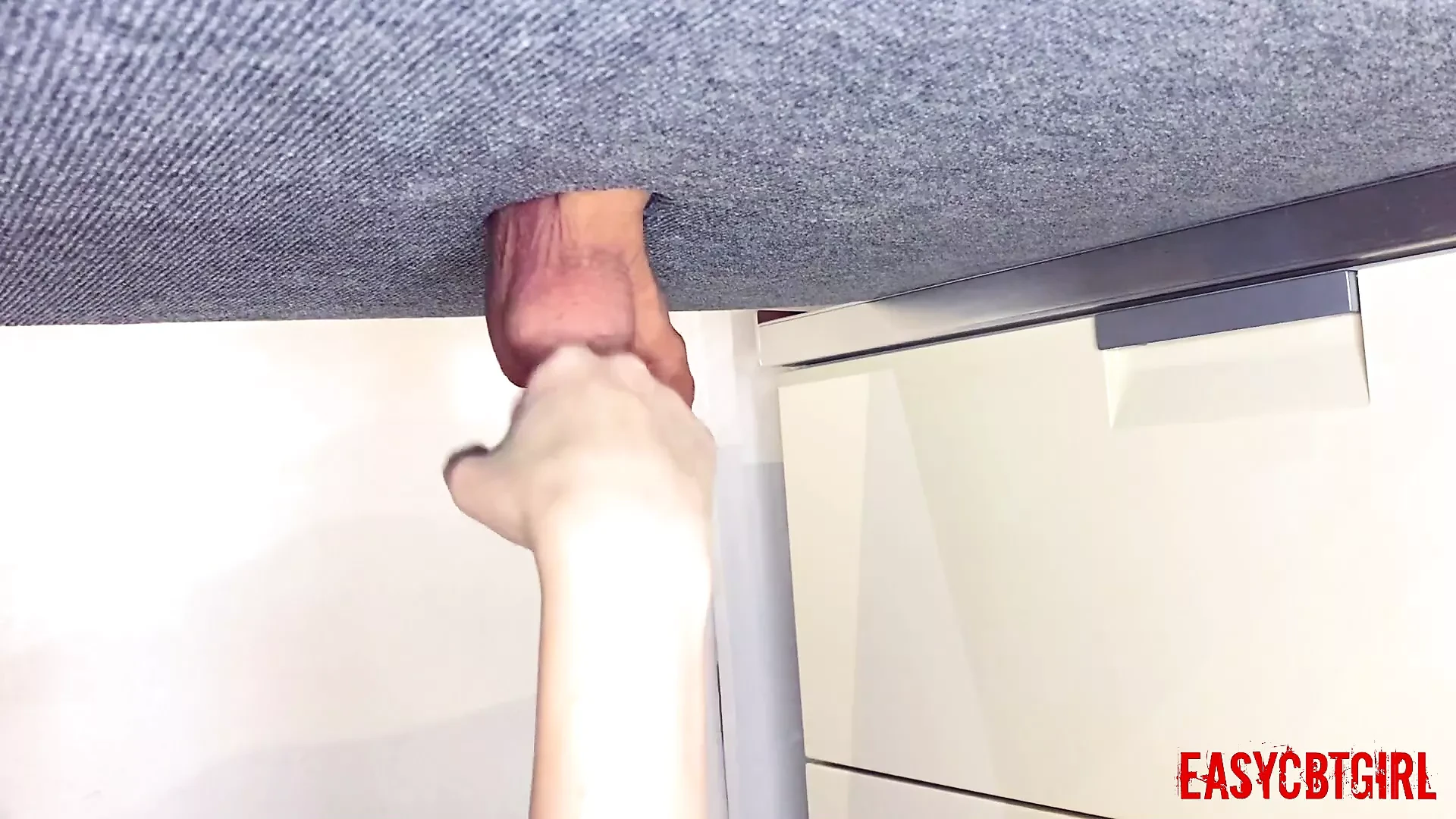 Mistress tickles the slave's balls with her fists and slaps