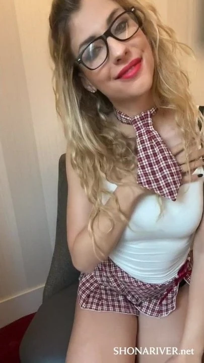 Hot young girl in a schoolgirl cosplay uses a sex toy