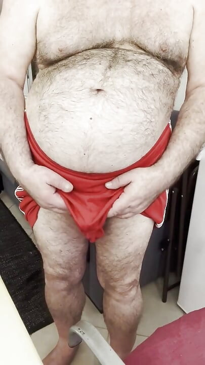 Coach Karl's Balls Accidentally Slip Out of His Gym Shorts, While Stroking His Cock.