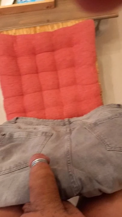 stroking my ringed cock on my pants