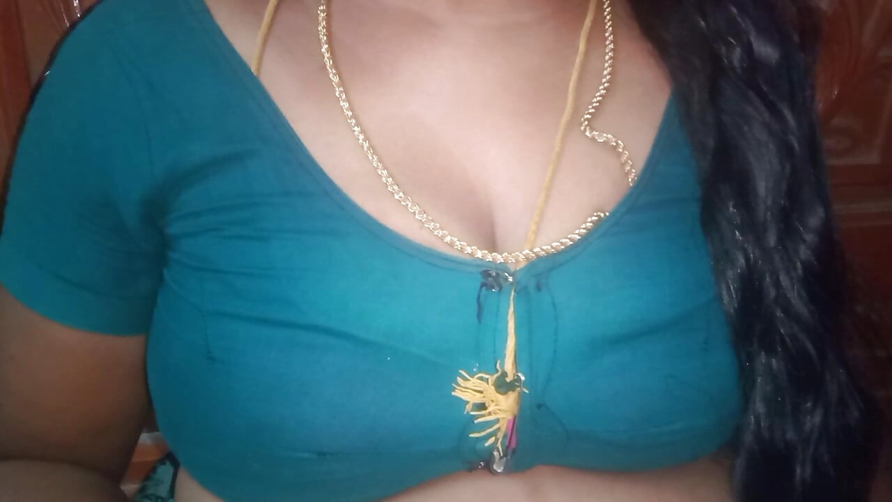 Tamil aunty squeezing her breasts when she is alone and unable to control her emotions.