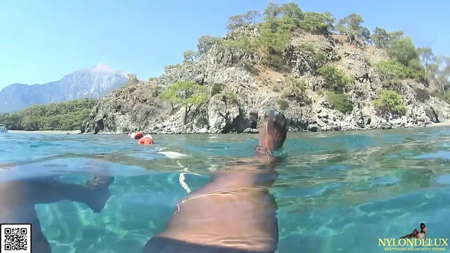 Peniscage&stocking in the public sea