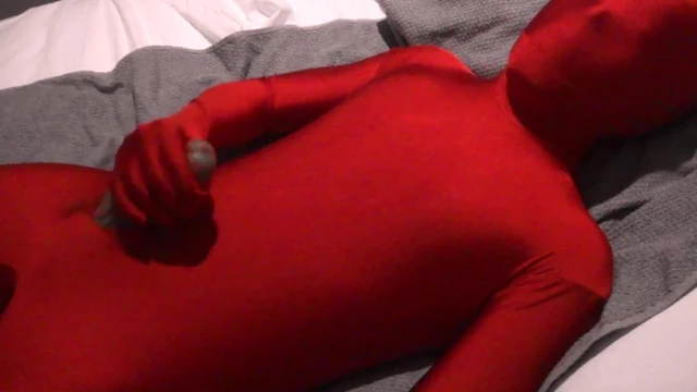Red Zentai Twink Finishes Off Handjob