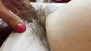 Hairy pussy in white swimsuit closeup