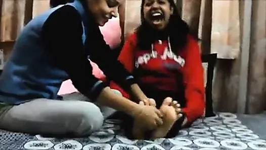 Indian girl getting her feet tickled
