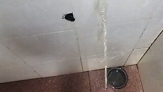 Pissing on the wall, man cock dripping