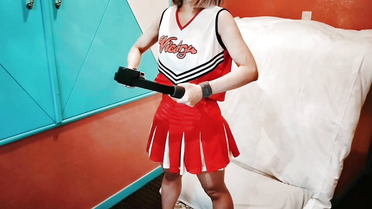 A cute, busty married woman does exercise 1 in an erotic cheerleader costume. Home made amateur Private Shoot
