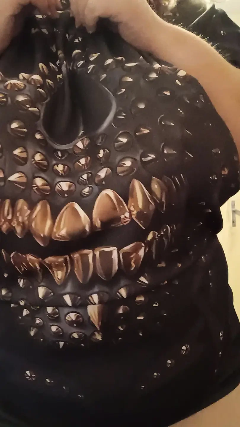 Petite tits under the black shirt