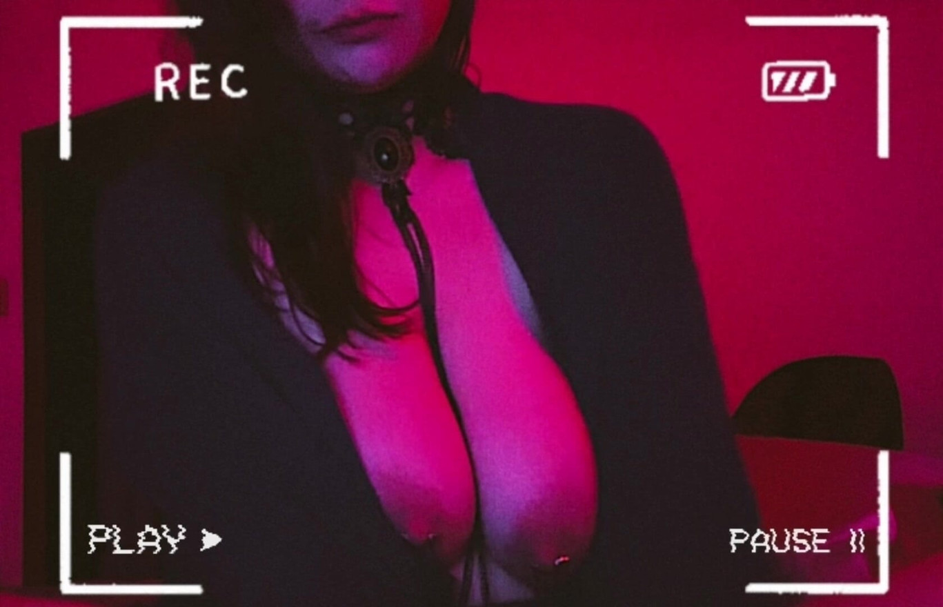 sexy milf with pierced nipples that is attached and chained to her collar