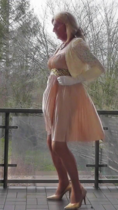 Memorable moment from "Wanking On A Winday Day In My Shiny Pleated Satin Gown"