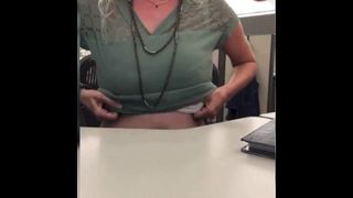 Sexy blonde having fun in the office