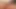 Brunette ladyboy with glosses strokes her hairy cock till