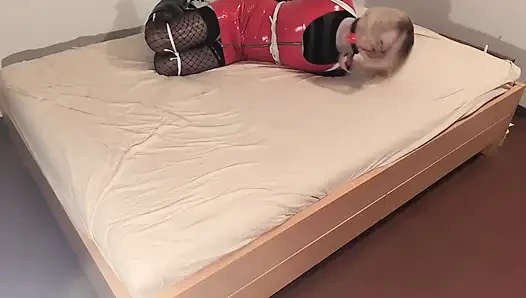 Hot Blonde in Hogtie, Long Latex Gloves, Red Pvc Dress and Stockings Let to Struggle to Get Free.