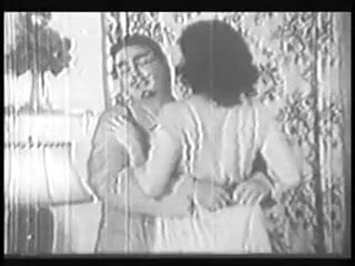 Woman with big ass and boobs gives head and does it doggy style in old b&w clip