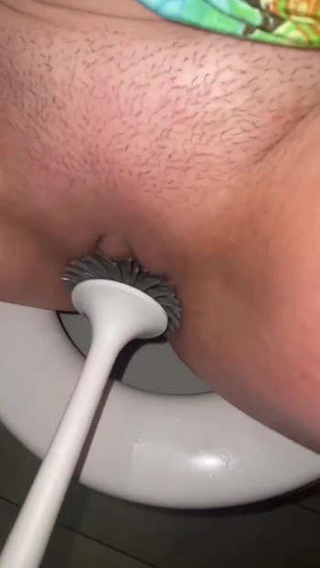 Captivating moment from "Licking public toilets in the hotel and playing with toilet brush"