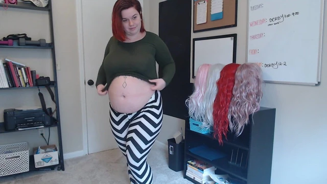 Chubby cutie plays with her belly