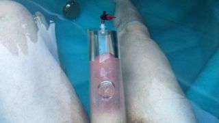 Pumping cock foreskin and balls in hot tub