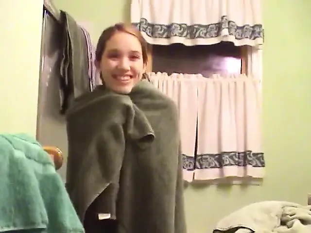 Cute brunette teen soaps up in the shower and takes time to trim her bush