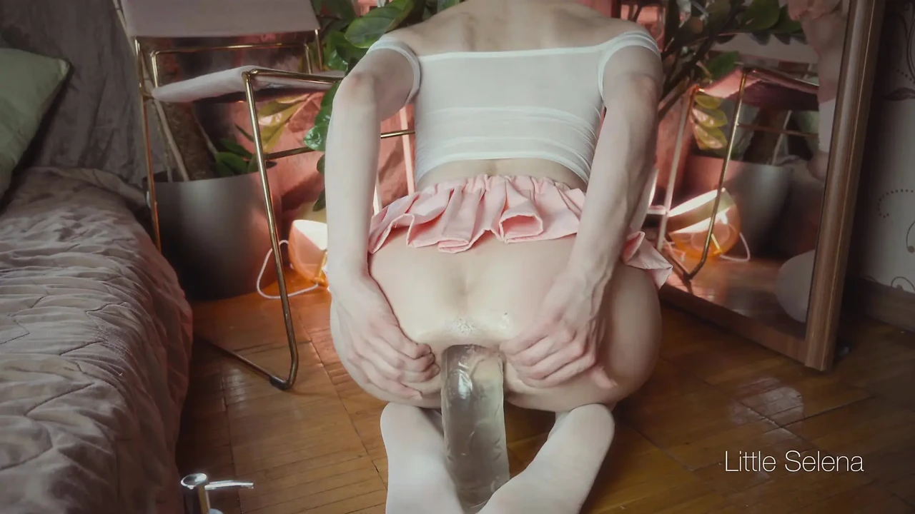 A beautiful girl stretches her ass with a huge toy