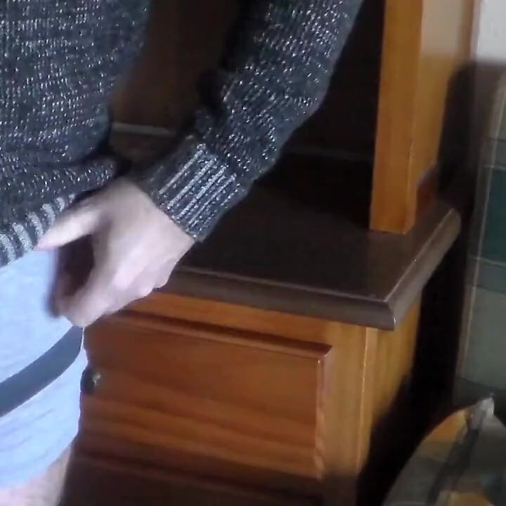 John is pissing all over the bookcase