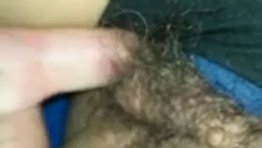 fingering her hairy pussy