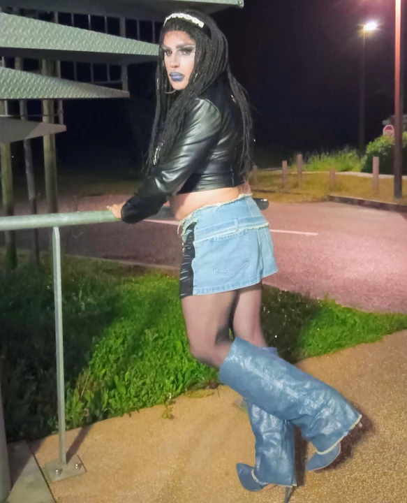 Sexy mature slut CD smoking outdoors in high heels and skirt