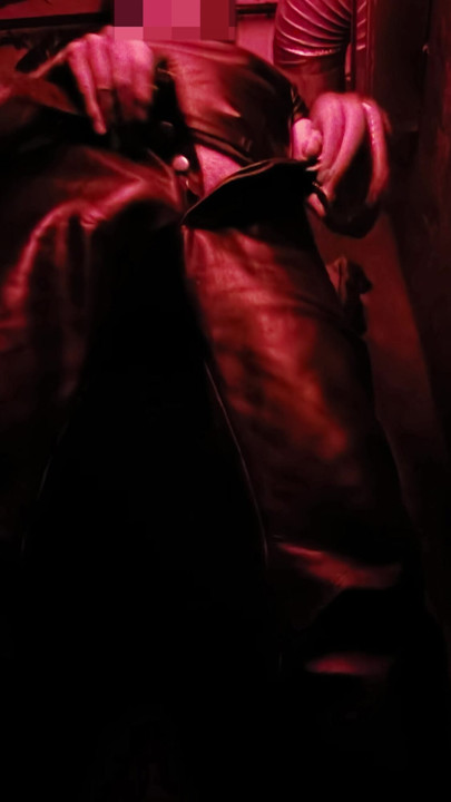 I show you my leather bulge in the corner of the darkroom, and then pull out my hard cock for you.