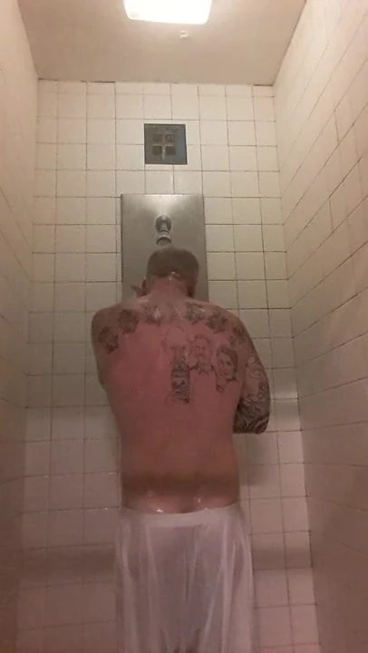Prisoner showers after haircut