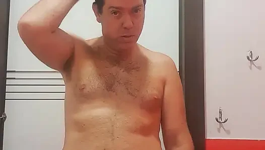 A boy completely naked in a station bathroom