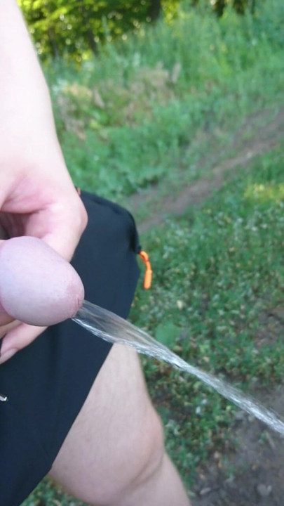 Guy Pissing in Nature