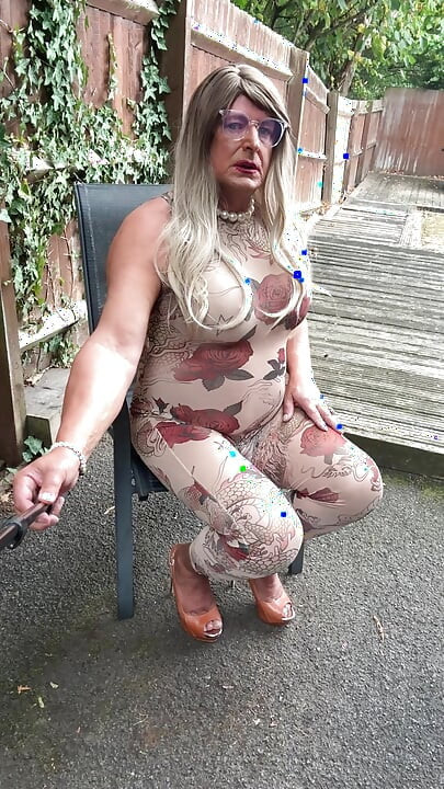Sexy Crossdresser kellycd2022 in sexy floral see thru catsuit and heels