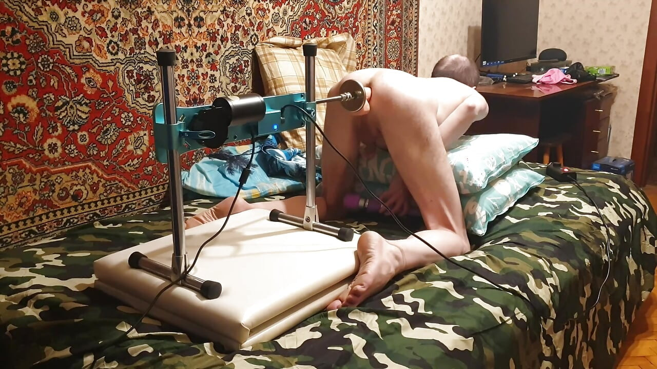 Hot gay having sex with a fuck machine