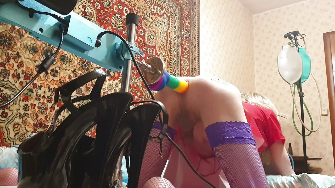 Sissy having deep anal sex with a fuck machine rainbow dildo