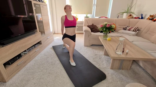 Redhead Teen masturbates with glass and sports slippers