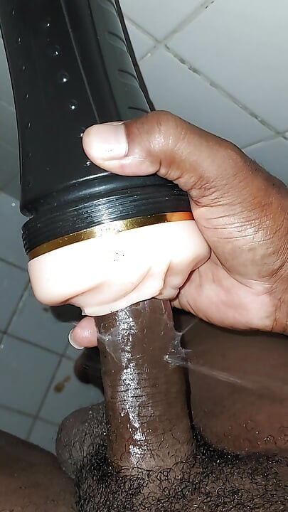 Black cock jerking off with flesh light