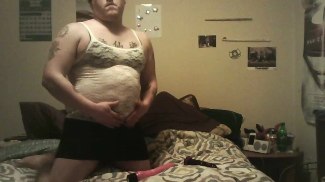 Laying on bed toying ass