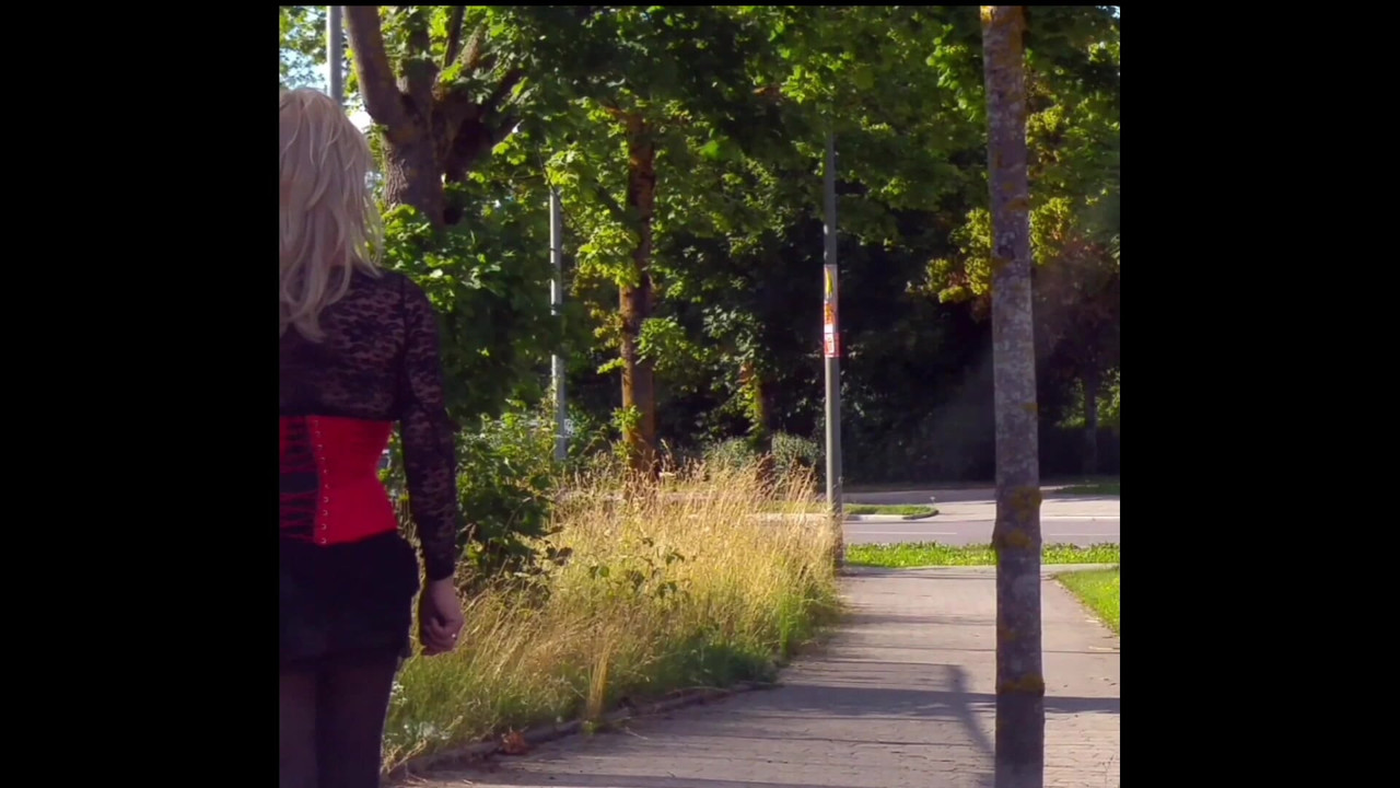 On the road with corsage and miniskirt
