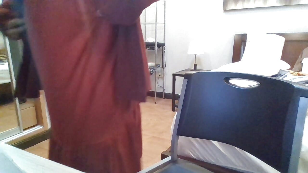 Indian crossdresser in red midi dress and cardigan