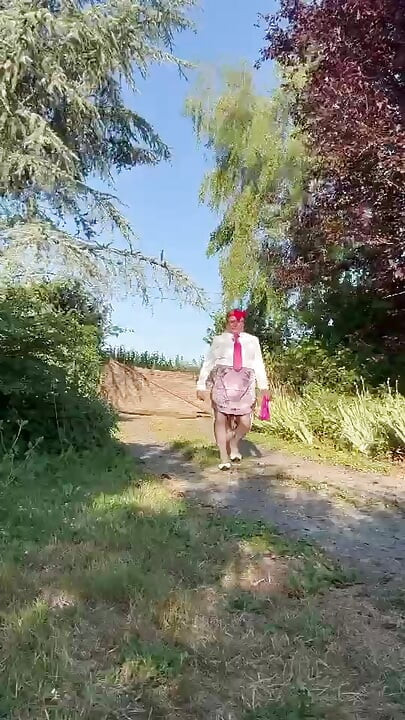 In little maid outfit with a short fuchsia skirt for a day