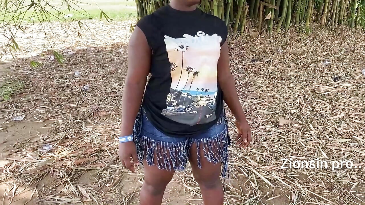 Ebony sexy black girl dances in outdoor with much laughter