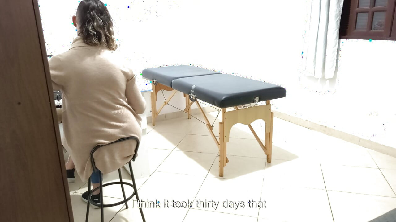 Proctologist performs anal exam on constipated patient.