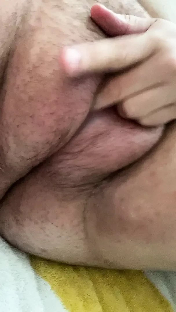 Playing with my hairy, saline filled pussy lips