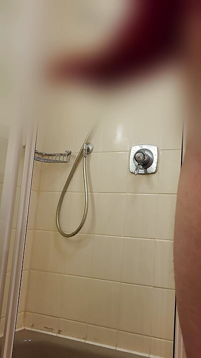 Guy showering in hotel
