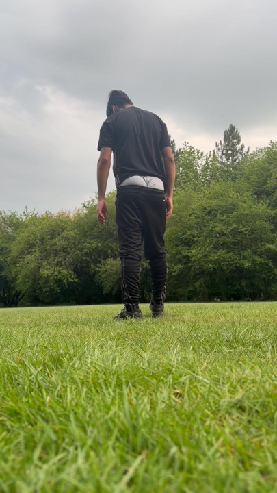 A twink boy showing dick in park