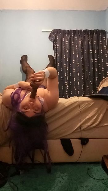 Aimee takes her dildo over the bed like a slut