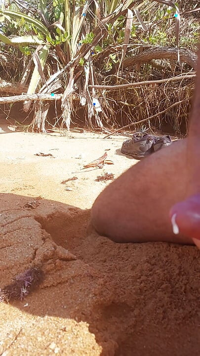 Ladysilva masturbating his cock on a deserted beach until he cums hot