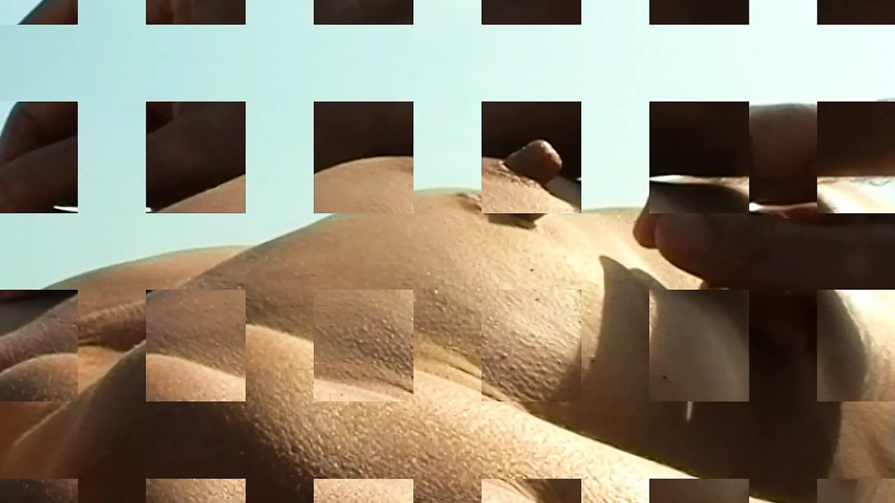 Mature with long nipples teasing on public beach 1