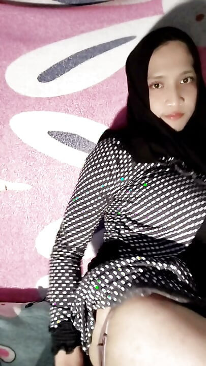 A Beautiful Hijab Is Coming Home From Her Wedding Dress