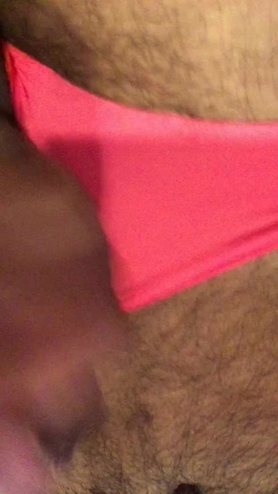 Uncut cock cumming on hairy chest wearing pink panties