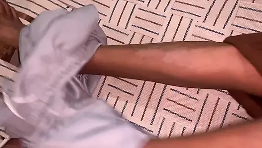 Lying on the cot, fingered the pussy.